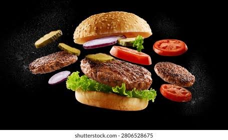 Burger gourmet dengan patty daging sapi, keju meleleh, sayuran segar, roti panggang, dan saus khas yang menggambarkan kuliner modern.